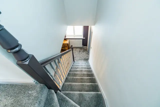 Finished staircase access to a converted loft room